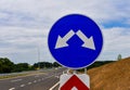 Road sign `Obstacle detour on the right or left side`, installed on the road Royalty Free Stock Photo