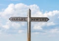 Road sign with old life and new life direction against sky Royalty Free Stock Photo
