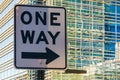 Road sign `One way` on the background of office building Royalty Free Stock Photo