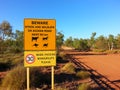 Road sign in outback Australia Beware caution Royalty Free Stock Photo