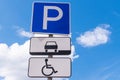 Road sign parking against the blue sky. Parking sign for disabled people. Close-up Royalty Free Stock Photo