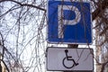 The road sign parking is allowed for disabled people