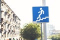 Road sign pedestrian underpass against the blue sky. Royalty Free Stock Photo