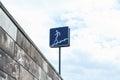 Road sign pedestrian underpass against the blue sky with fluffy clouds Royalty Free Stock Photo