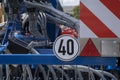 Road sign on a plow trailer speed limit to 20 km per hour Royalty Free Stock Photo