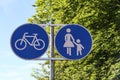 A road sign points to a footpath and a bike path Royalty Free Stock Photo