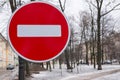 Road sign prohibiting traffic on the background of a winter city