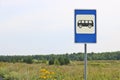 Road sign Public transport stop on the background of the summer landscape. Summer meadow