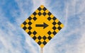 Road Sign with Right Arrow Isolated on against a Dramatic Blue Sky Royalty Free Stock Photo