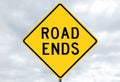 Road sign - road ends in clouds