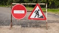 Road sign on the road. Work repair sign. Repair of roads. To make asphalt. Road Ahead Closed and Diversion signs in a street Royalty Free Stock Photo