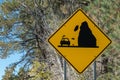 Road sign, rock slide warning and some added humor Royalty Free Stock Photo