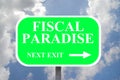 Road sign showing fiscal paradise on cloudy sky background Royalty Free Stock Photo