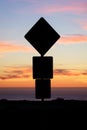 Road sign silhouette and colorful sunset Royalty Free Stock Photo