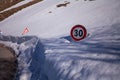 Road sign in the snow on the road to arrive in Castelluccio di Norcia, Umbria, Italy