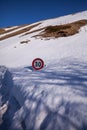 Road sign in the snow on the road to arrive in Castelluccio di Norcia, Umbria, Italy