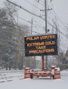 Road sign in snow warning of polar vortex Royalty Free Stock Photo