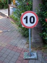 Road sign speed limit 10 on a pedestrian road. Speed limit in the pedestrian zone Royalty Free Stock Photo