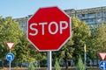 Road sign `stop` instructing drivers to stop completely