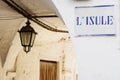 Road sign with street dialect name in a Puglia road