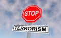 The road sign with text stop terrorism.