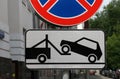 Road sign of tow truck evacuator with reflective layer on the streets of Moscow