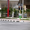 Road sign, traffic light and city with arrow for direction with travel information, typo or mistake for humor. Street