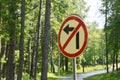 Road sign - turning is prohibited against the backdrop of green trees. Prohibitory road sign near a country road Royalty Free Stock Photo