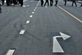 Road sign with two white arrows pointing in different left and right direction Royalty Free Stock Photo