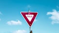 Yield Sign on a sunny day with clouds Royalty Free Stock Photo