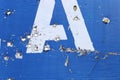 The road sign of the village, in the place of hostilities. Bullet holes in metal