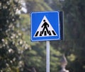 Road sign warning pedestrian crossing in the city