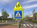 Road sign warning for a school zone. Royalty Free Stock Photo