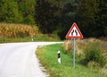 Road sign that warns drivers of constriction on the road Royalty Free Stock Photo
