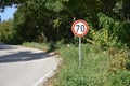 Road sign that warns drivers that maximum speed is 70 kilometers per hour