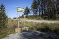 Road sign on road about waterfall on Oster River in Karelia