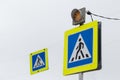 Road sign white triangle with a man in a blue square means a pedestrian crossing Royalty Free Stock Photo