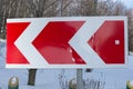 Road Sign on a winter day. Winter forest landscape behind