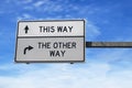 Road sign with words this way and the other way.  White signs with arrow on metal pole. Directional road, Crossroads Road Sign, Royalty Free Stock Photo