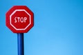 Road signal STOP - isolated on blue