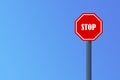 Road signal STOP - isolated on blue