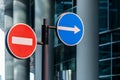 Road signs against modern glass building background Royalty Free Stock Photo