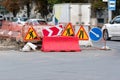Road signs `Detour obstacles on the right` and `Road works` on the repair and construction work on the street. Under construction Royalty Free Stock Photo