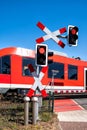 Road signs at the railway crossing with traffic light Royalty Free Stock Photo