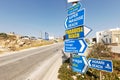 Road signs showing the directions to the famous beaches in Mykonos: Paradise beach, Super Paradise beach and Agrari beach