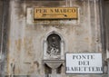 Road signs on a wall in Venice