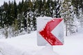 Road signs warning drivers about ahead dangerous curve in winter time Royalty Free Stock Photo