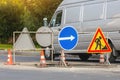 Road signs!Road works with trucks and traffic signs.road works road blocked signs and traffic cones diversion access onlyBarriers Royalty Free Stock Photo