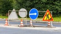 Road signs!Road works with trucks and traffic signs.road works road blocked signs and traffic cones diversion access onlyBarriers Royalty Free Stock Photo