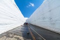 Road between snow wall of Tateyama Kurobe Alpine Route or Japa Royalty Free Stock Photo